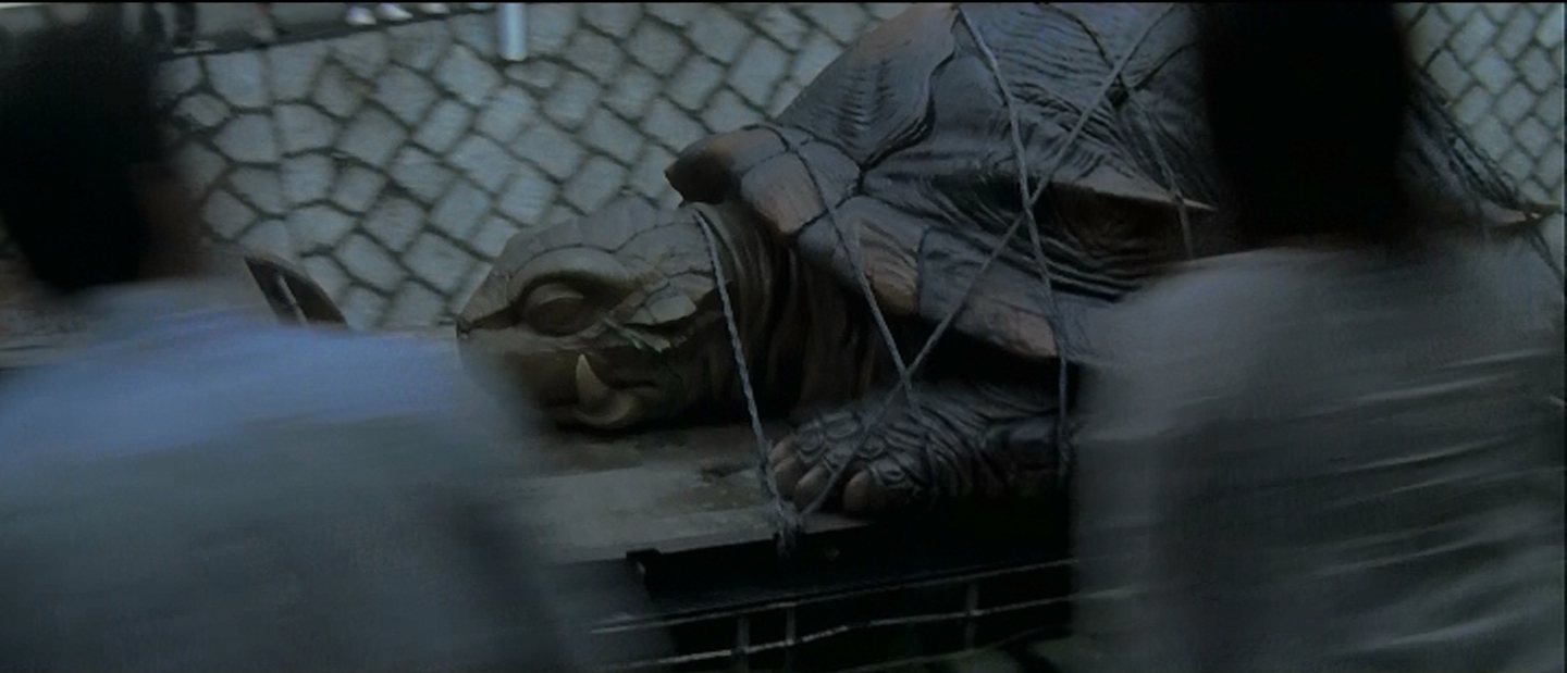 Gamera, following in Gorgo's tiretracks