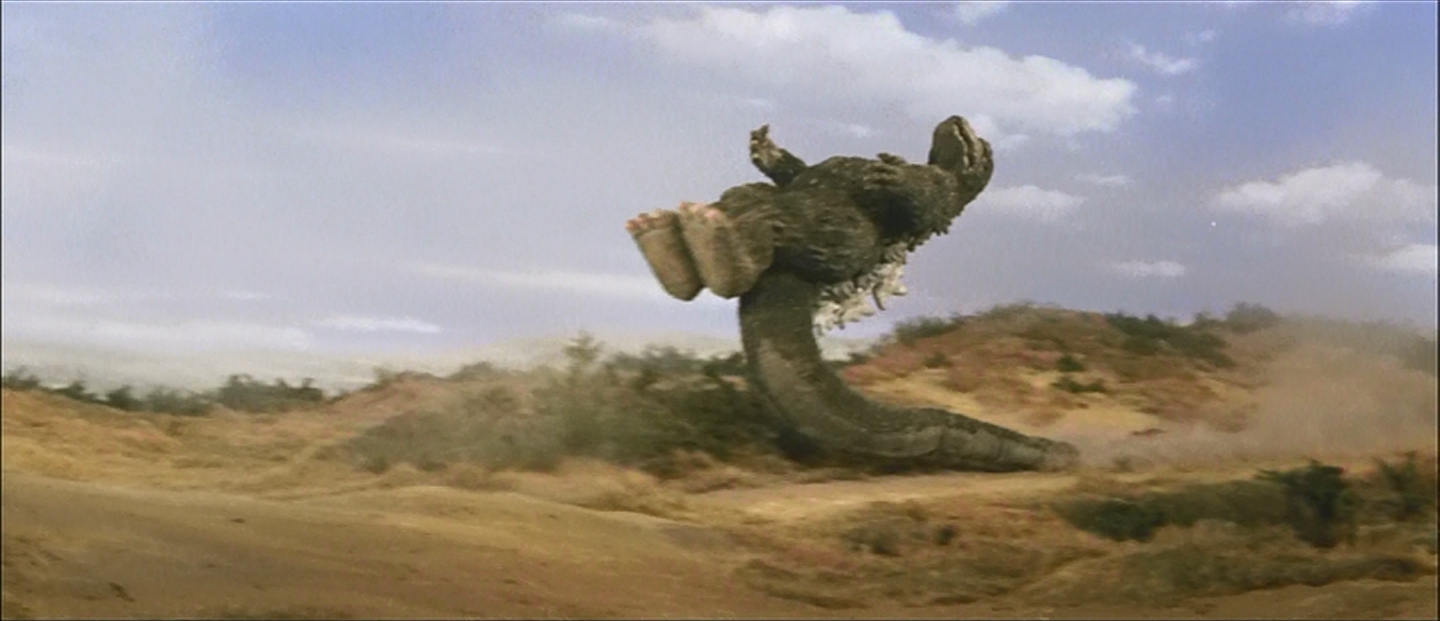 The infamous Godzilla tail-supported drop kick.