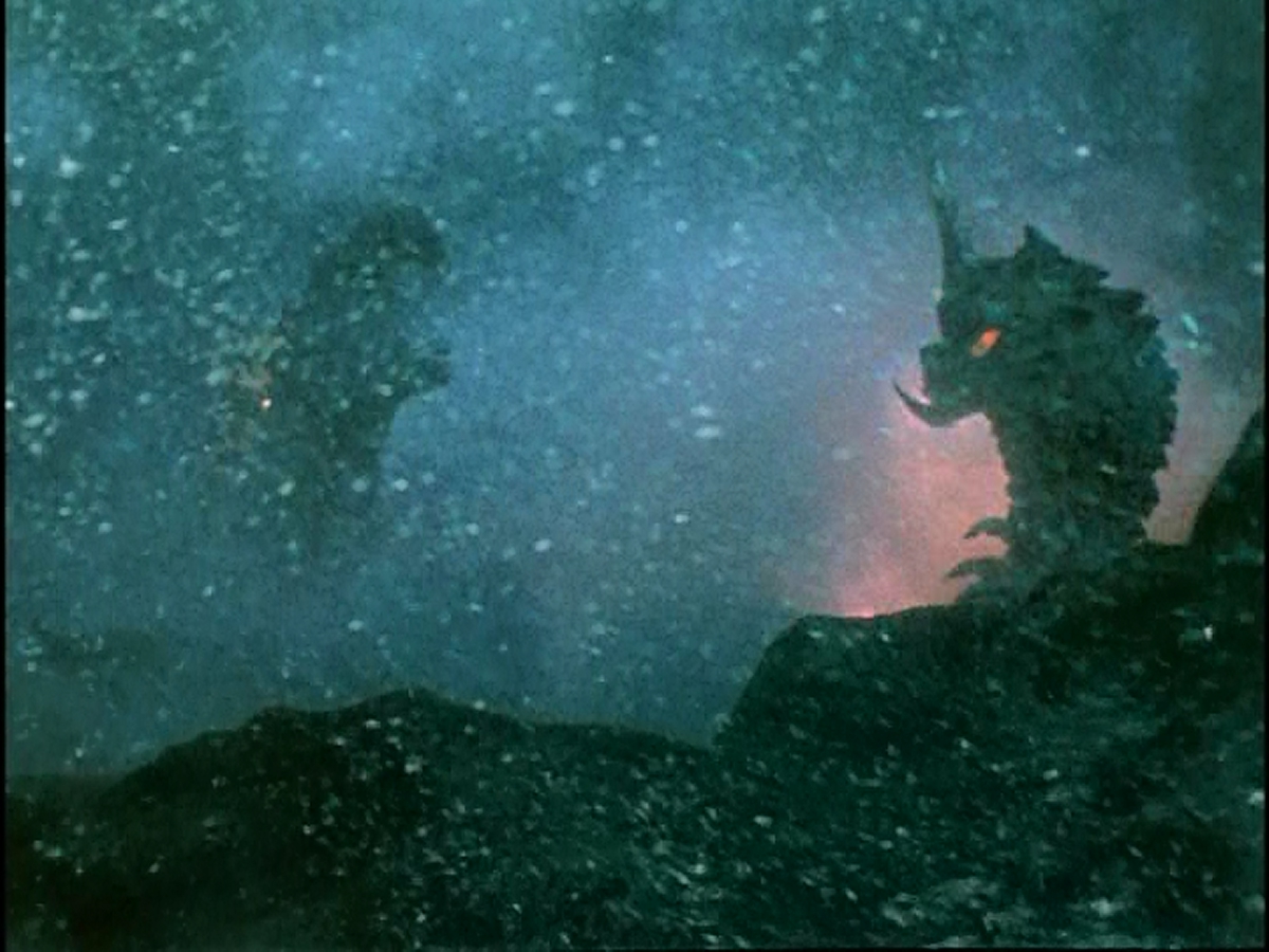 Battra and Godzilla fight so hard they open a magma fissure