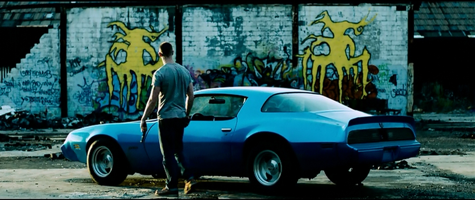 Guns, ruins, and a muscle car: the most Detroit picture you will ever see outside of Robocop.