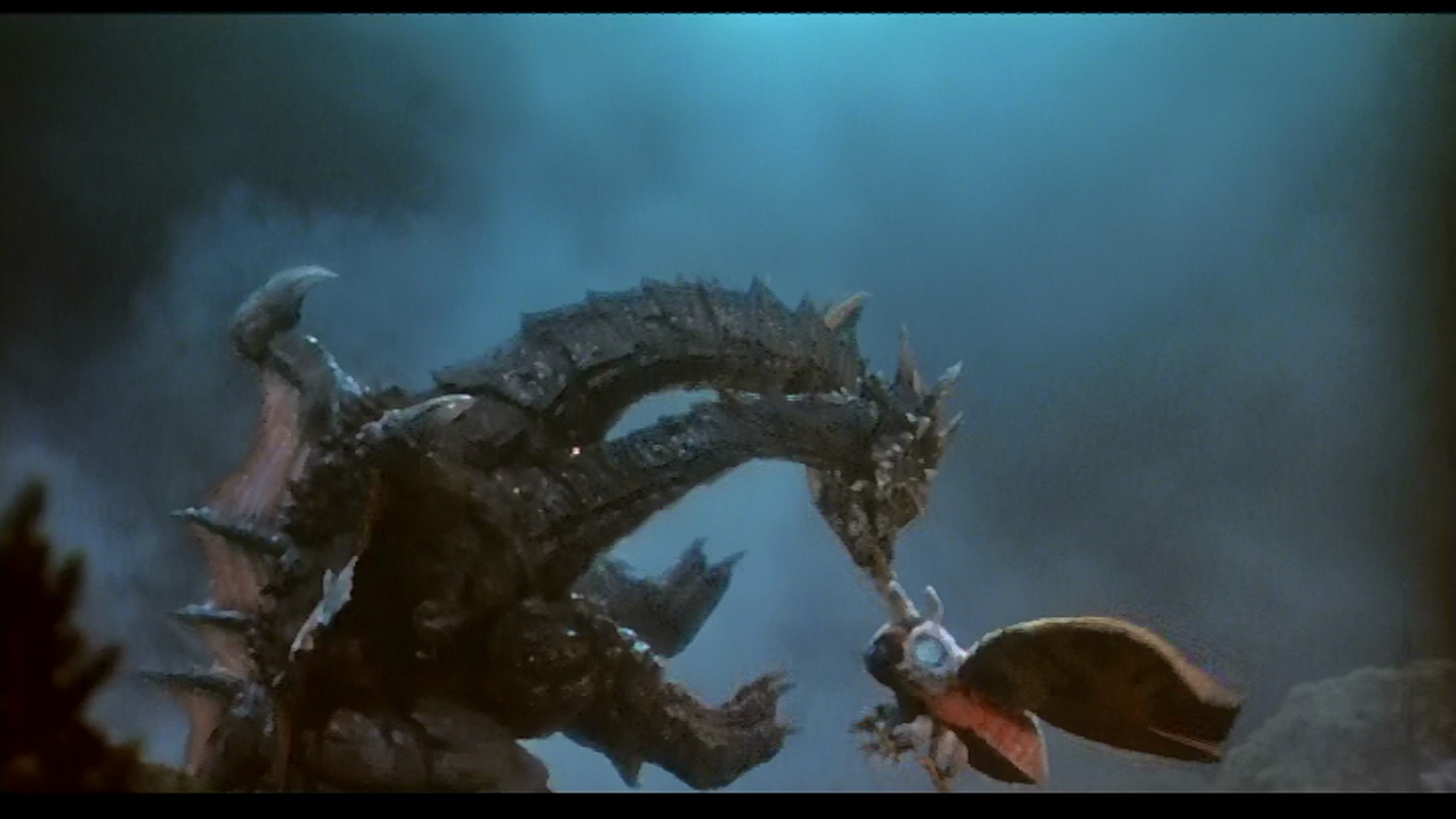 Death Ghidorah gnaws on Mothra