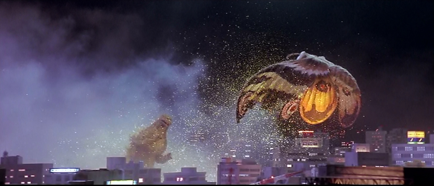 Mothra, using her poisonous scales.